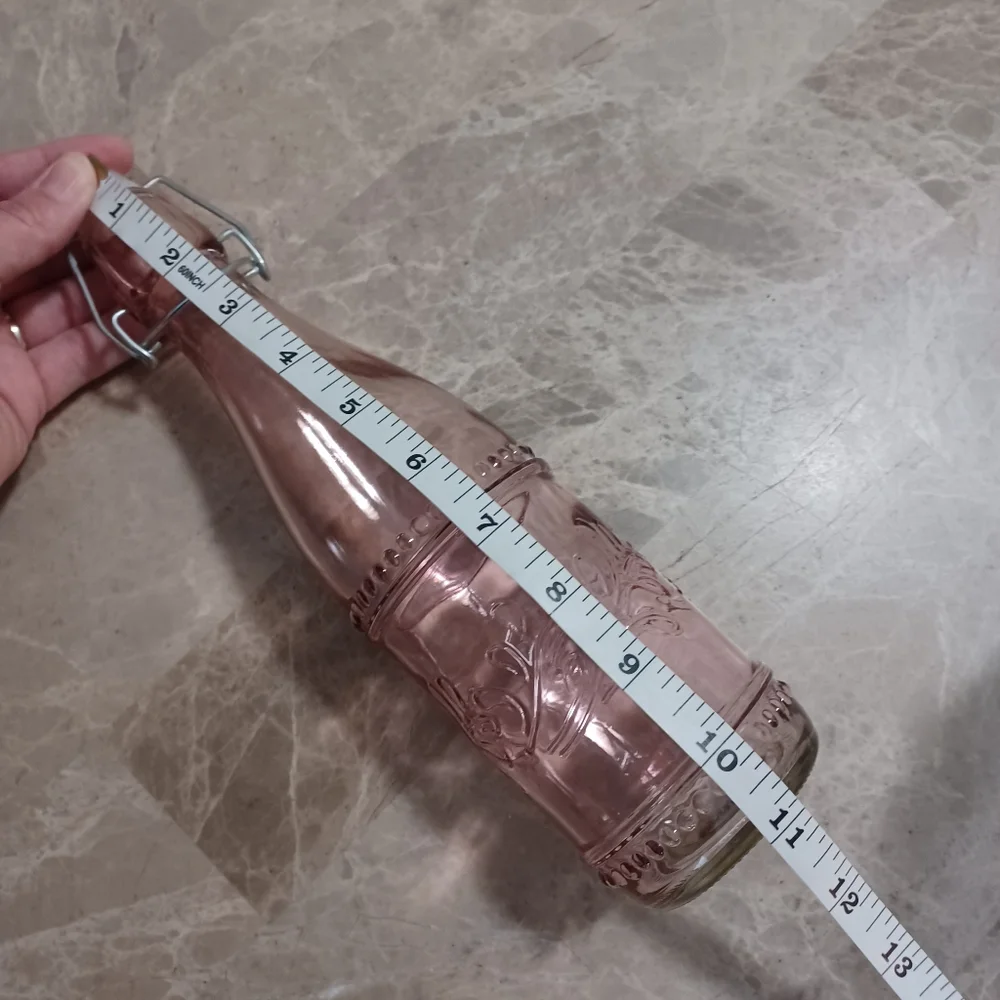 Set of Three Decorative Glass Bottles Clear Glass Light Pink And Teal Vases